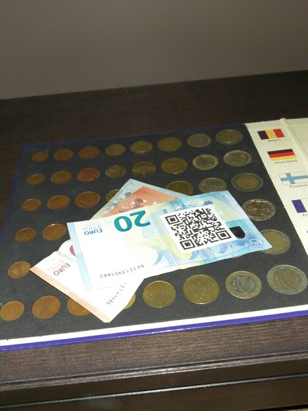 The Cash with a visible QR Code